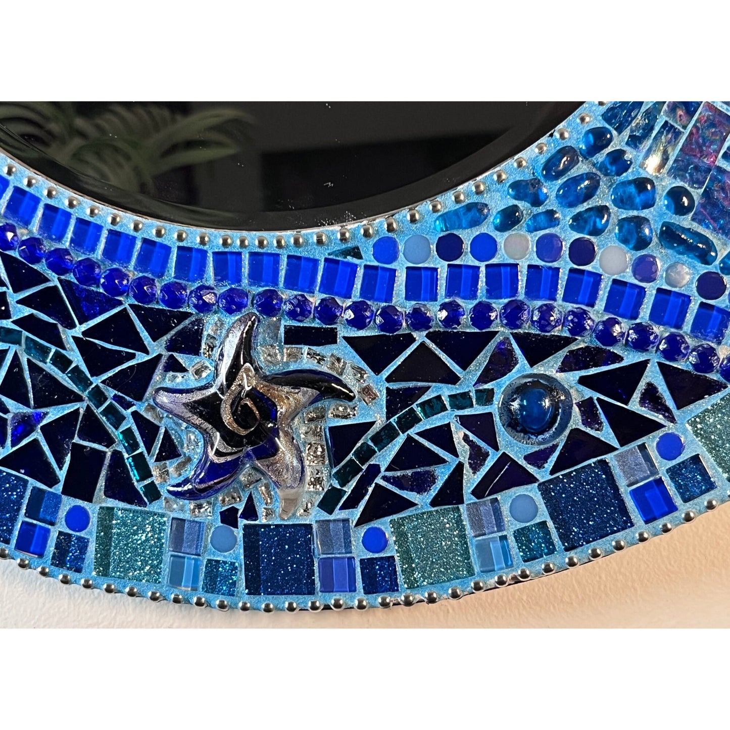 bottom view:
18" Mosaic Frame with 10" beveled mirror. In rich ocean hues with glass, ceramic, glass beads and glitter tiles