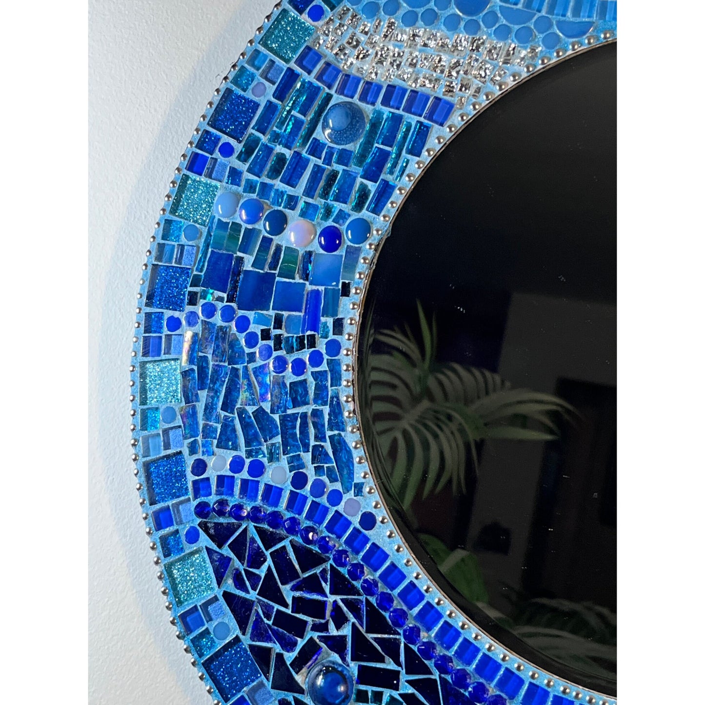 left side:
18" Mosaic Frame with 10" beveled mirror. In rich ocean hues with glass, ceramic, glass beads and glitter tiles