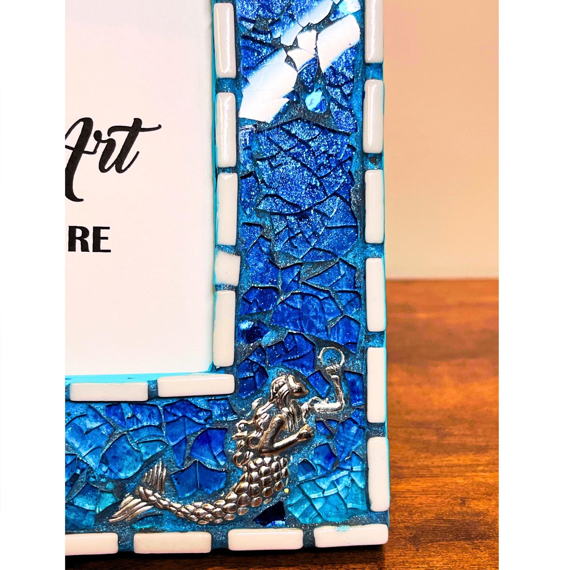 bottom right close up:
5 x 7 tempered glass and mosaic photo frame in shades of blue with silver mermaid charms on the bottom