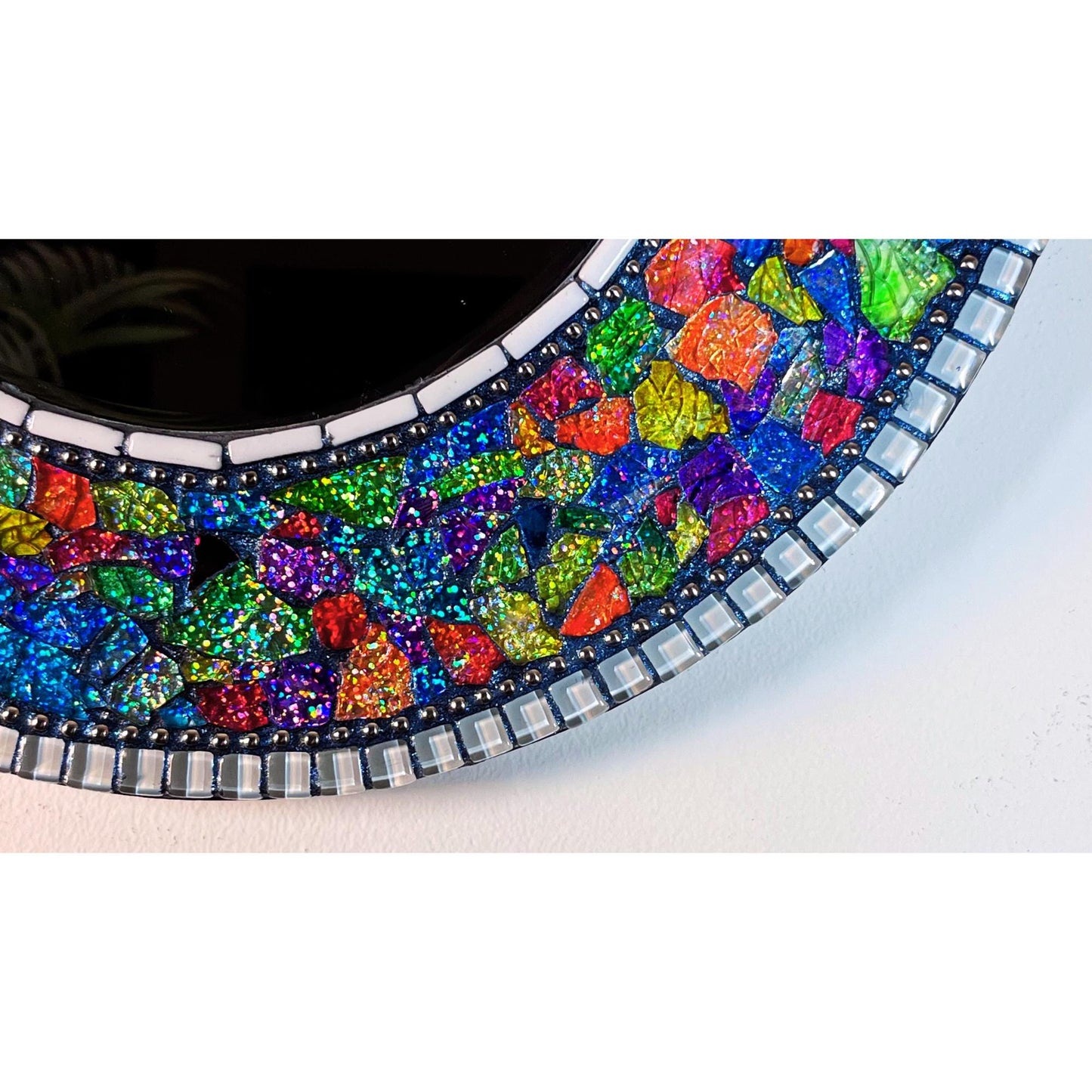 bottom photo of the completed fantasy garden mirror with the dark blue grout