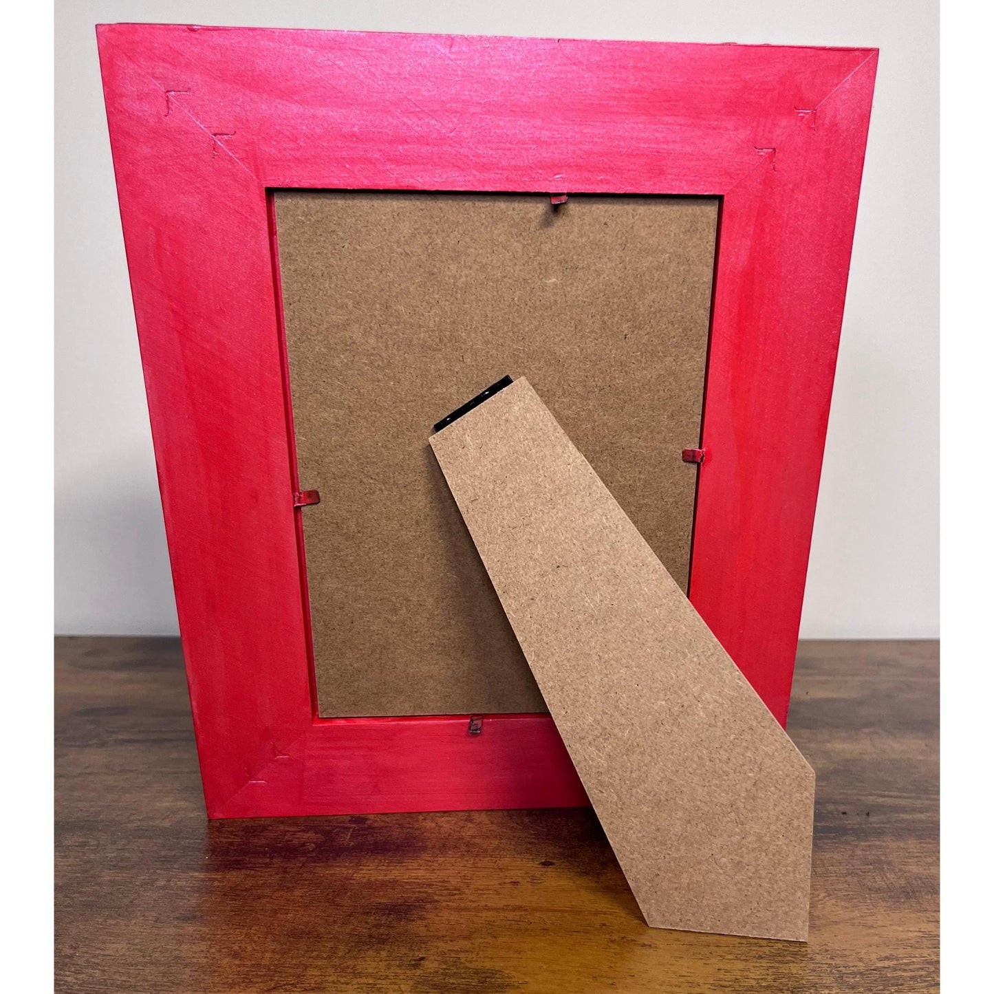 back of frame, painted red, vertical view.