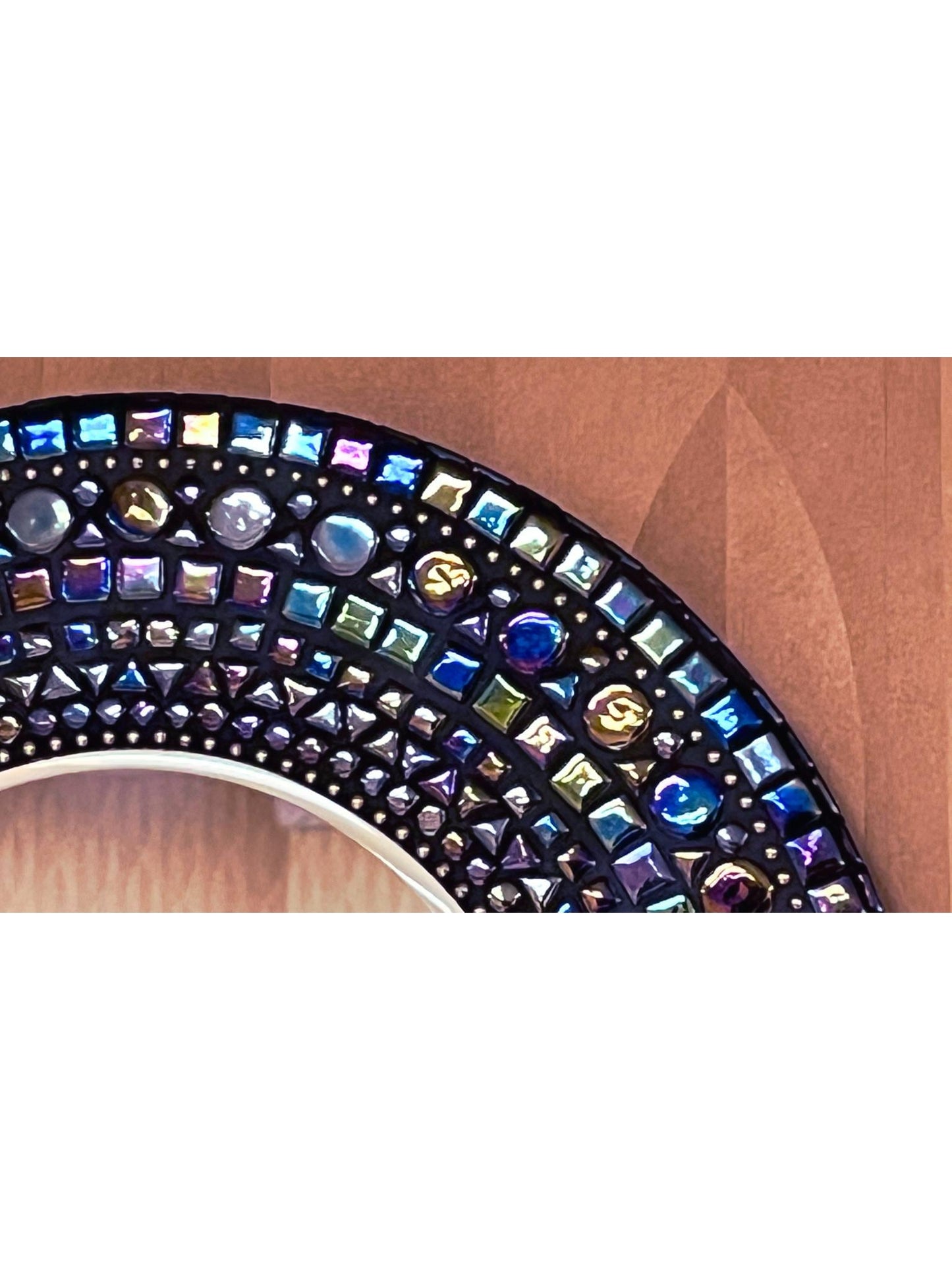 Top right extreme close up
Color is Black Opal Iridescent Tiles. With 2 Brass chain borders.
Shapes are different sized squares,small and large circles and triangles.