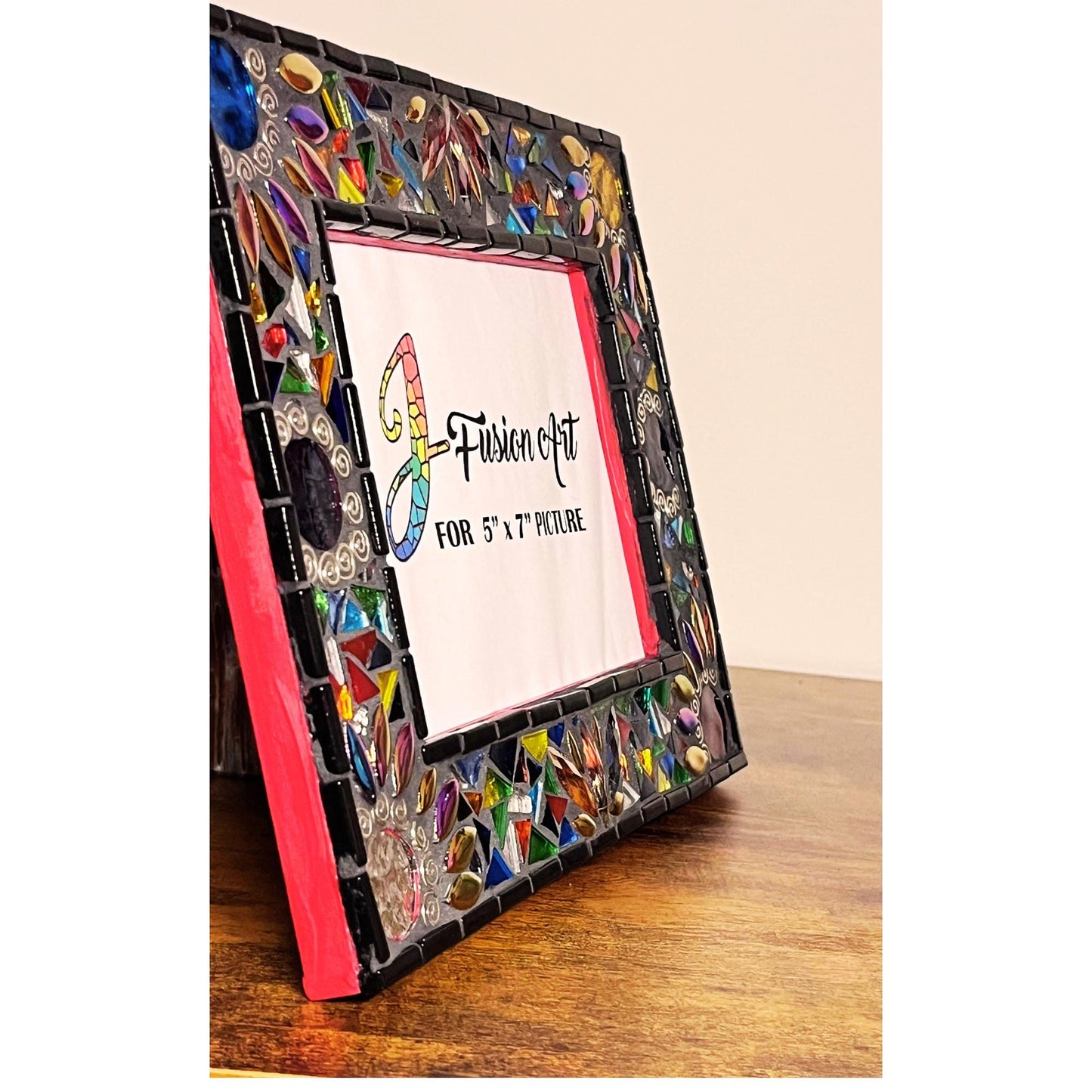 Side view of frame showing the red painted side, black tiles as well as the side of the glass.