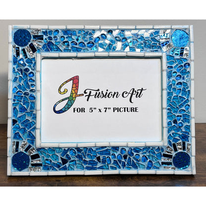 Front View of 
5x7 blue picture frame.Tempered Glass over blue sheer ribbon fabric.  Clear circles in the corners showcase metallic blue lycra fabric