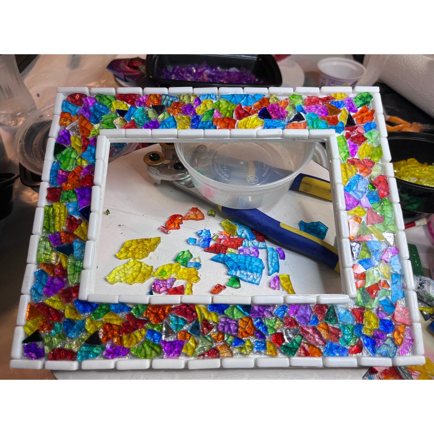 this is what the frame looks like after gluing down the class and colored mirror and before grouting