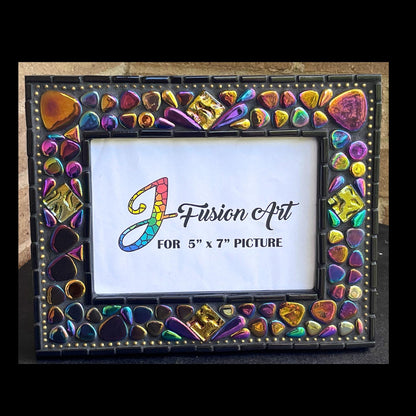 Front View:  
5x7 Photo Frame:  Various sized Pebble Shaped Iridescent tiles.  Also Iridescent mosaic leaves and gold textured tiles.  Border of frame in black tiles with a silver ball chain inside of the border for contrast.  Grouted in black mosaic grout.