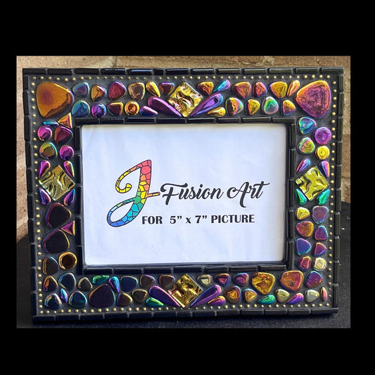 Front View:  
5x7 Photo Frame:  Various sized Pebble Shaped Iridescent tiles.  Also Iridescent mosaic leaves and gold textured tiles.  Border of frame in black tiles with a silver ball chain inside of the border for contrast.  Grouted in black mosaic grout.